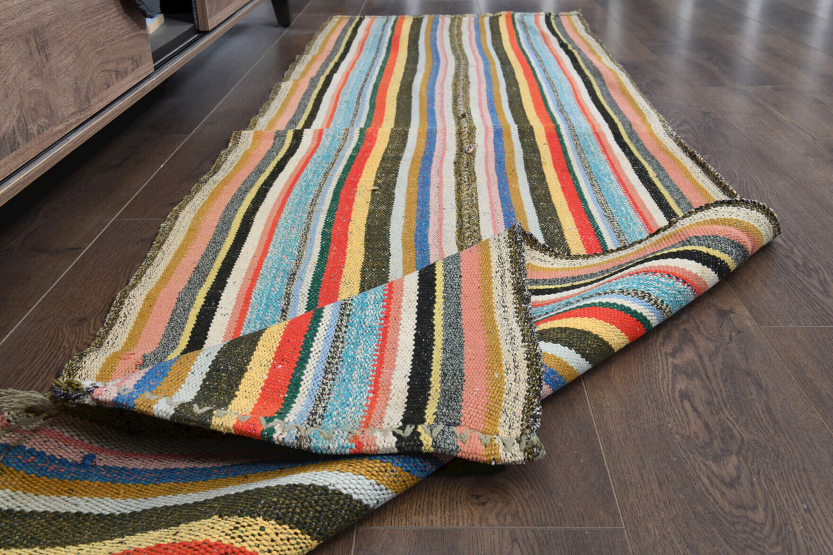 Hazanihal kilim: 1960s handwoven flatweave Anatolian kilim with striped motifs and fabric backing