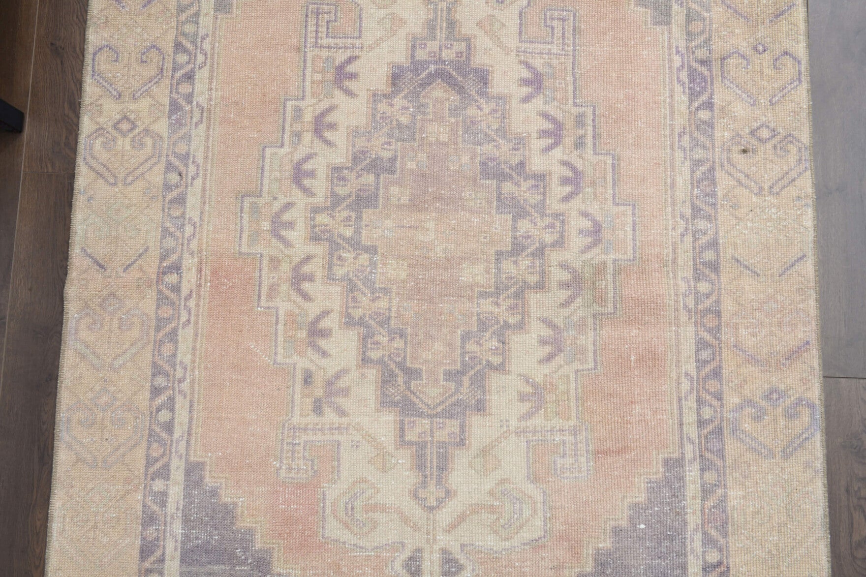 Filizbahar rug: 1970s handmade Anatolian rug with oriental motifs and cotton backing