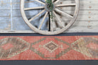 Melisisik runner: 1970s handmade Anatolian runner with tribal motifs and cotton backing