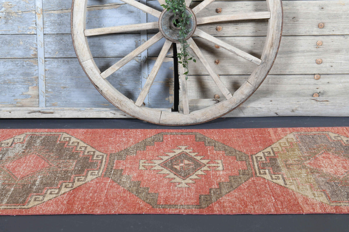 Melisisik runner: 1970s handmade Anatolian runner with tribal motifs and cotton backing