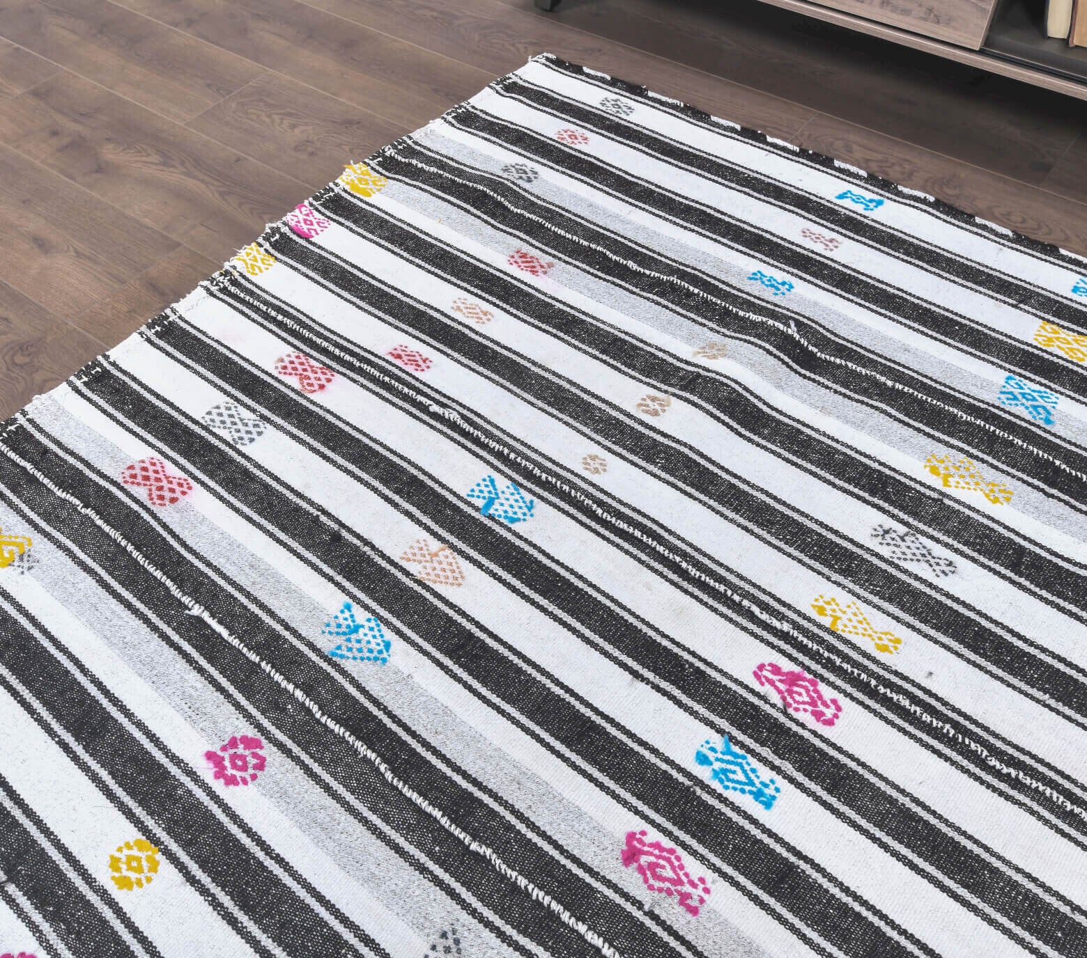 Kallinesia rug: 1970s handmade Anatolian rug with striped motifs and cotton backing