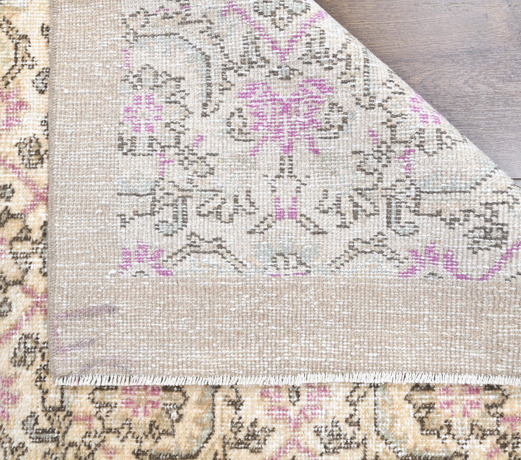 Glikonike rug: 1960s handmade Anatolian rug with floral motifs and cotton backing