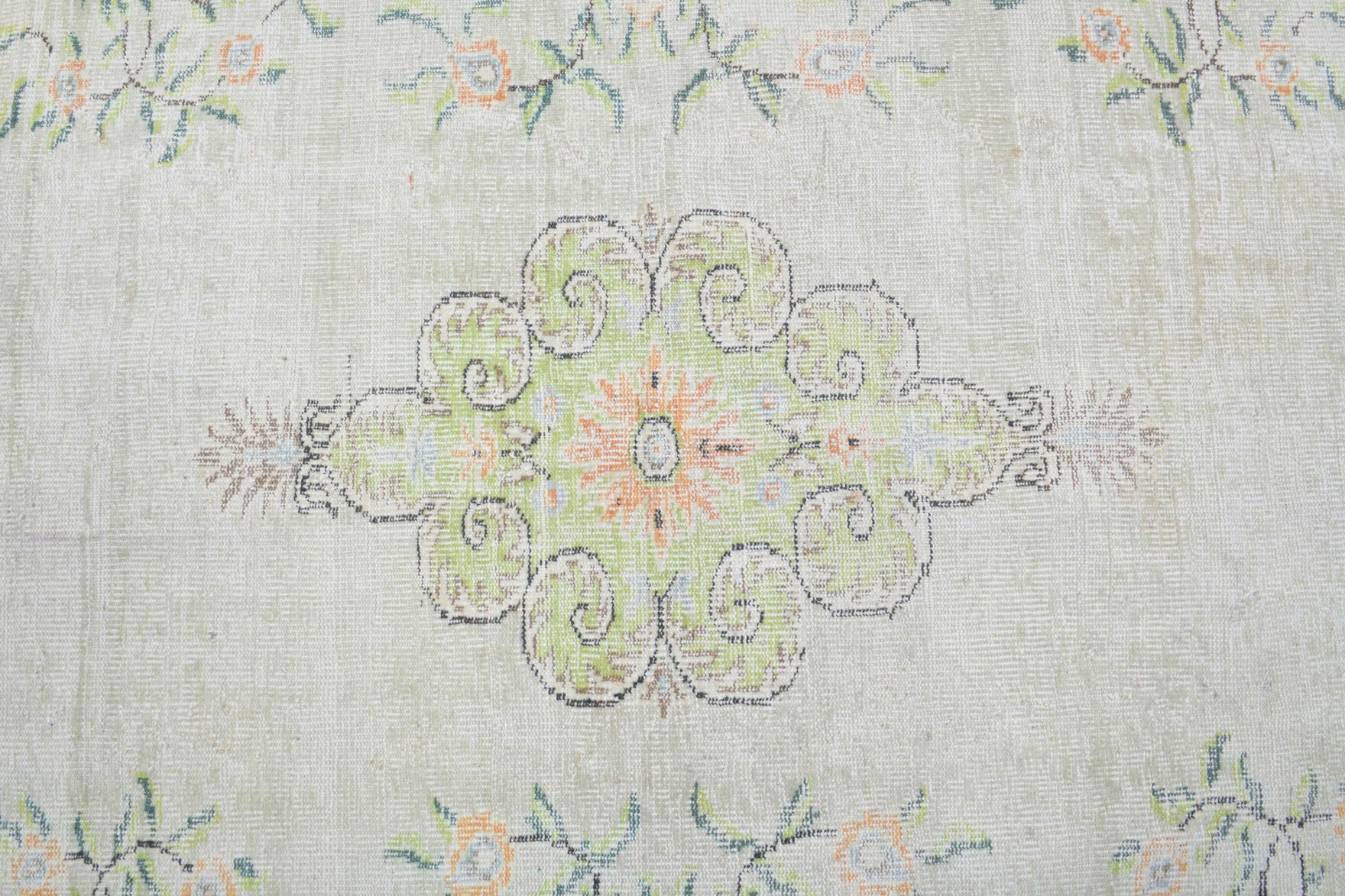 Ipekcihan rug: 1970s handmade Anatolian rug with floral motifs and cotton backing