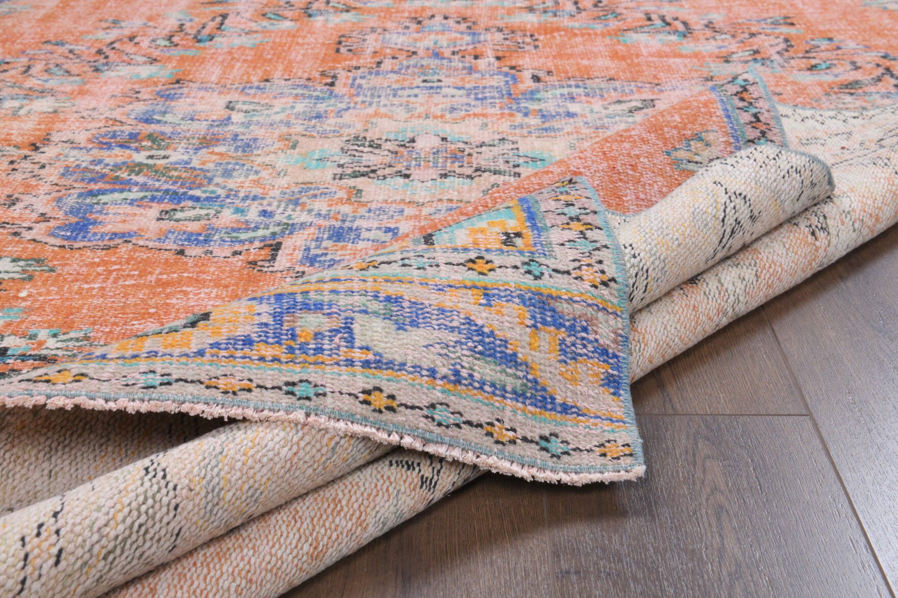 Sadberkban rug: 1970s handmade Anatolian rug with oriental motifs and cotton backing