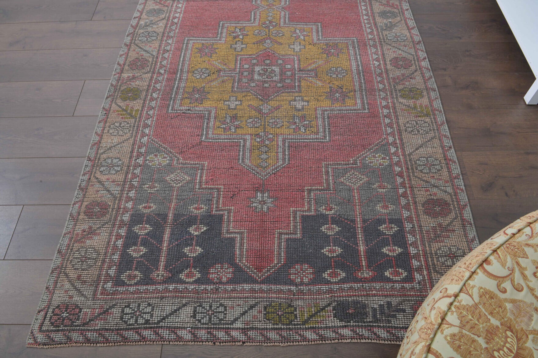 Nevnisin rug: 1970s handmade Anatolian rug with oriental motifs and cotton backing