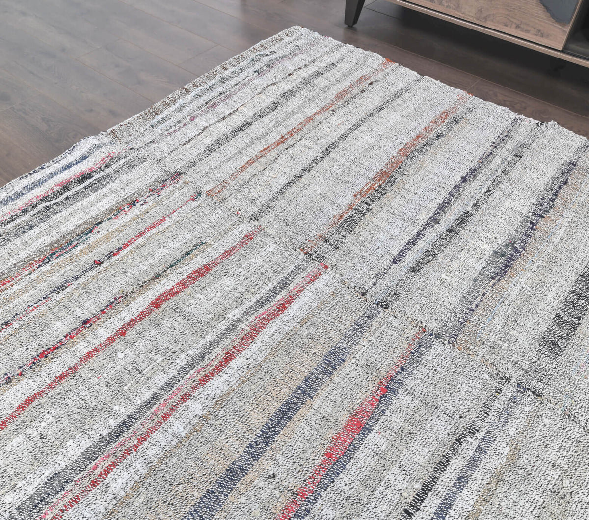Eirenephaessa kilim: 1970s handwoven flatweave Anatolian kilim with striped motifs and cotton backing