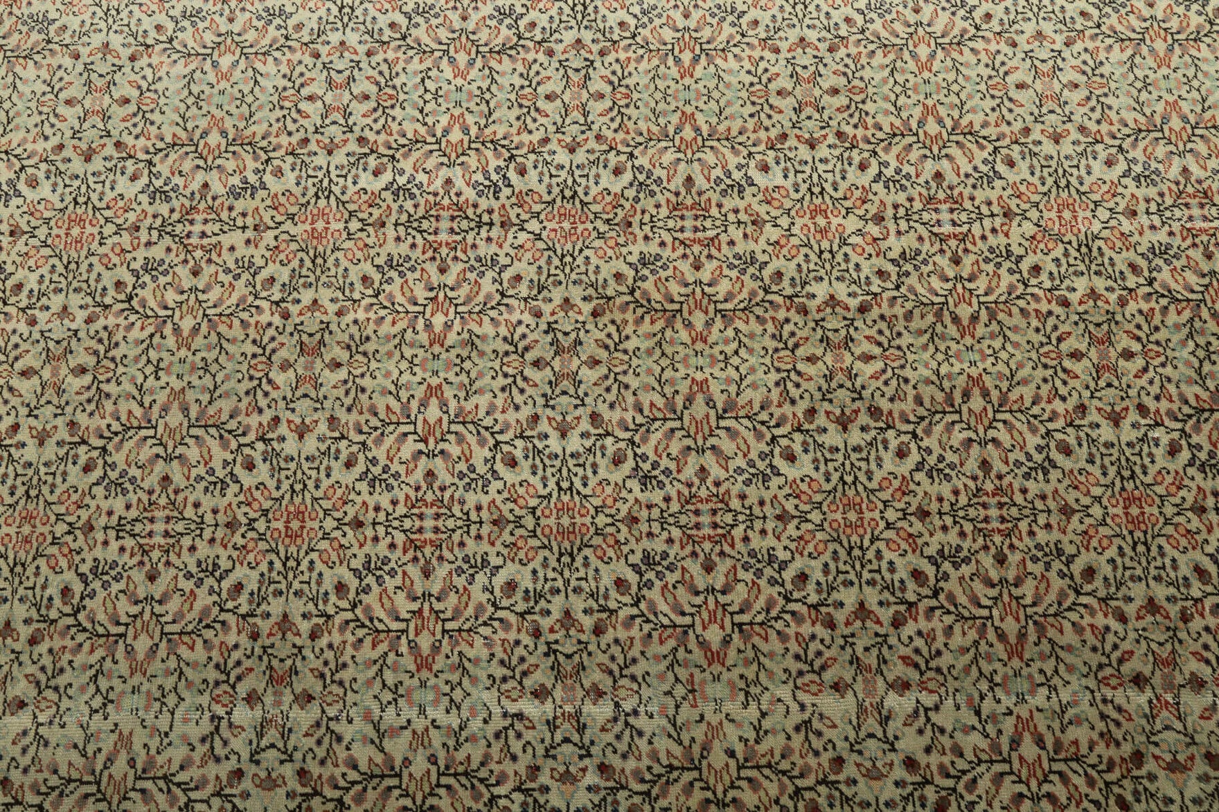Bercem rug: 1970s handmade Turkish rug with floral motifs and cotton backing