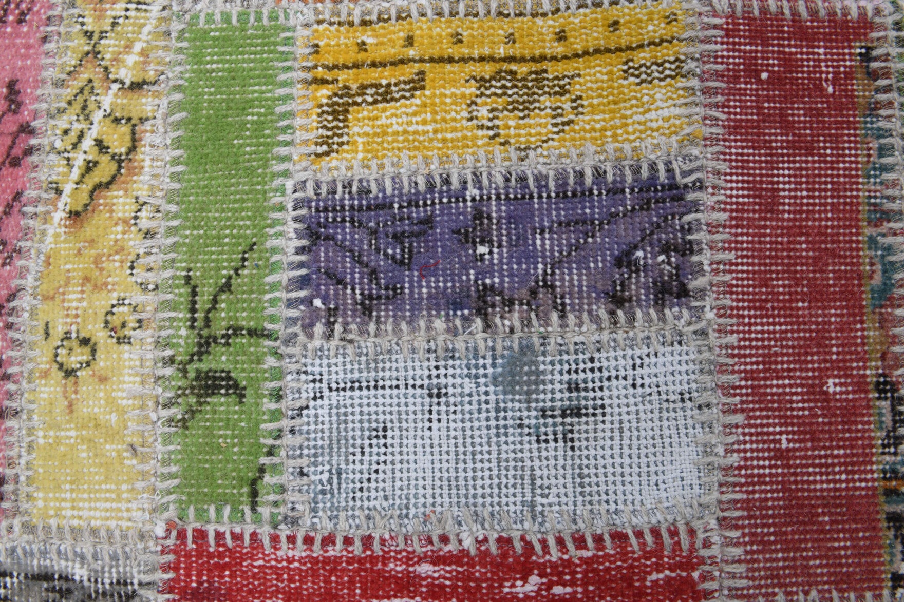 Angin rug: 1970s handmade Anatolian rug with tribal motifs and fabric backing