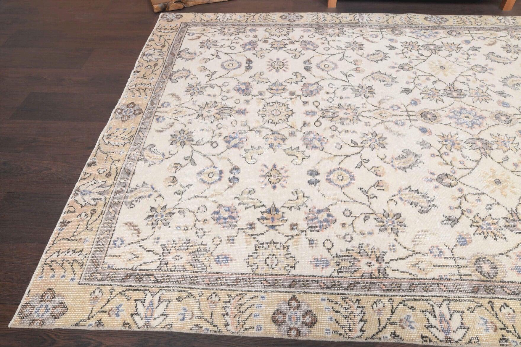 Anthopeia rug: 1970s handmade Anatolian rug with bordered and floral motifs and cotton backing