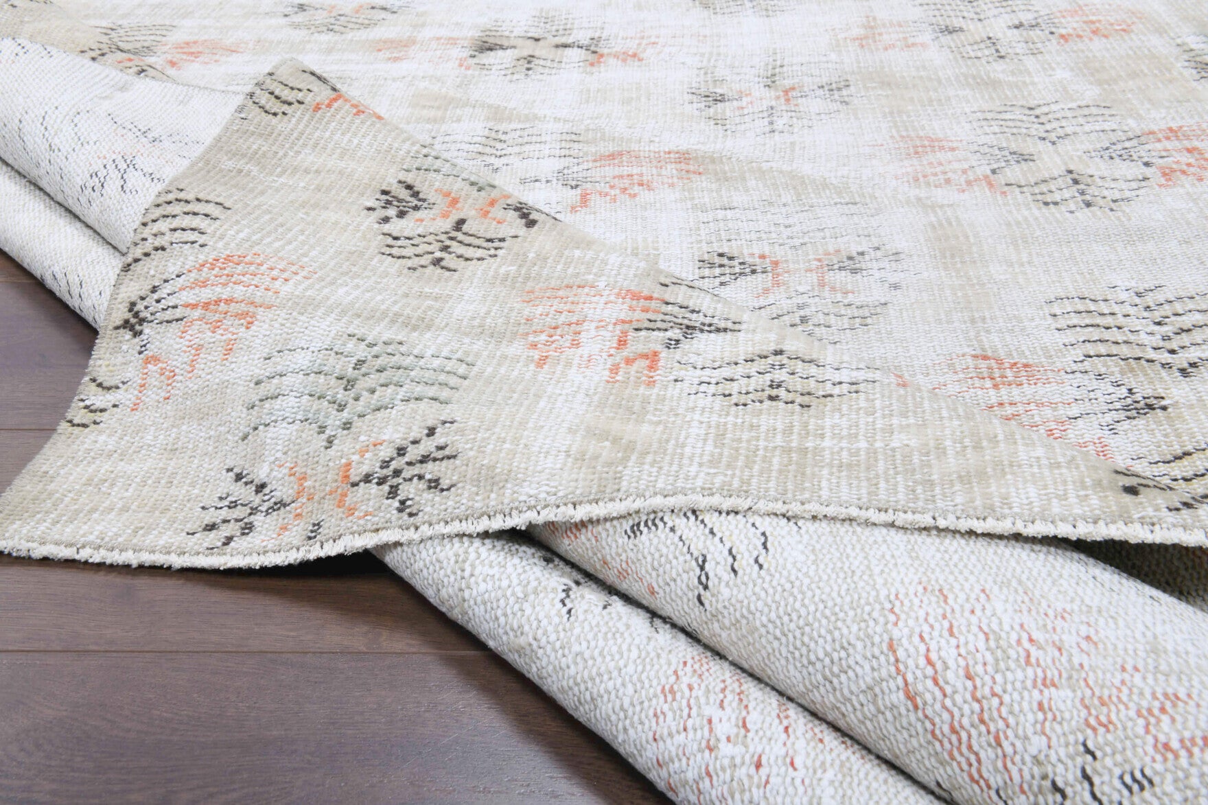 Sevval rug: 1950s handmade Anatolian rug with ikat motifs and cotton backing