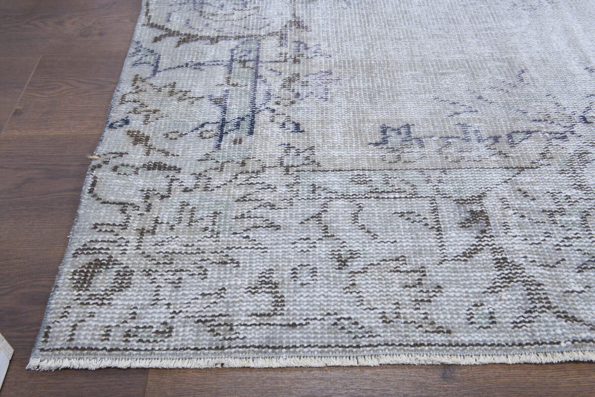 Semasad rug: 1950s handmade Anatolian rug with floral motifs and cotton backing