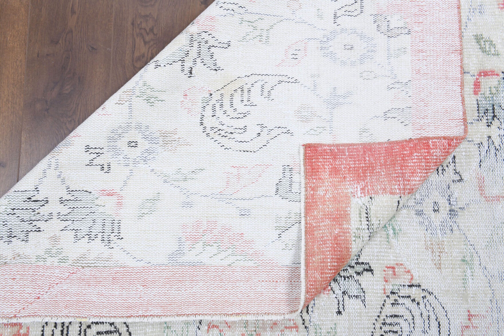 Authentic Anatolian antique washed vintage area rug (1940s) with floral and bordered design – one-of-a-kind at Fame Rugs