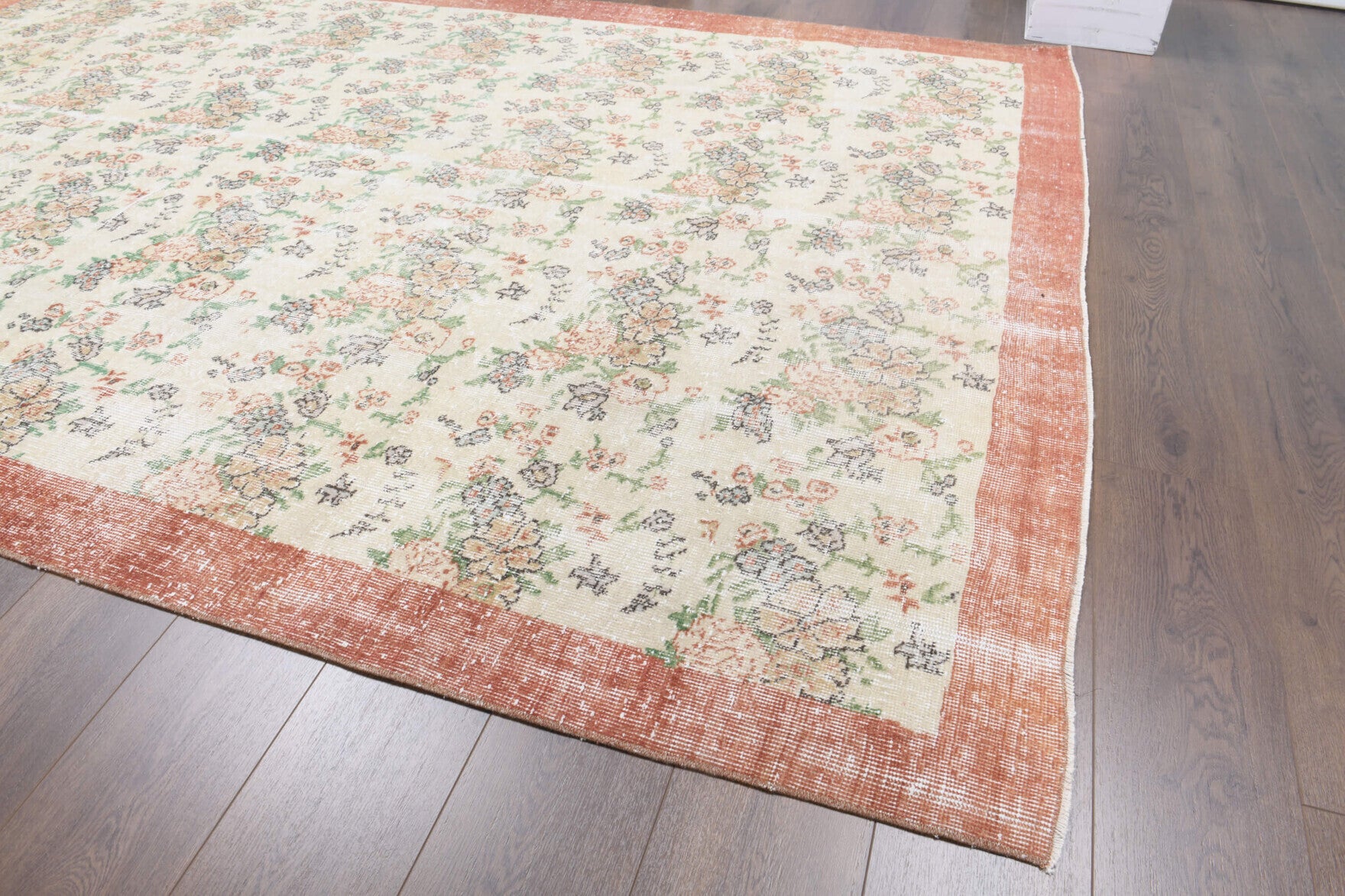 Oykuhayat rug: 1970s handmade Anatolian rug with bordered and floral motifs and cotton backing