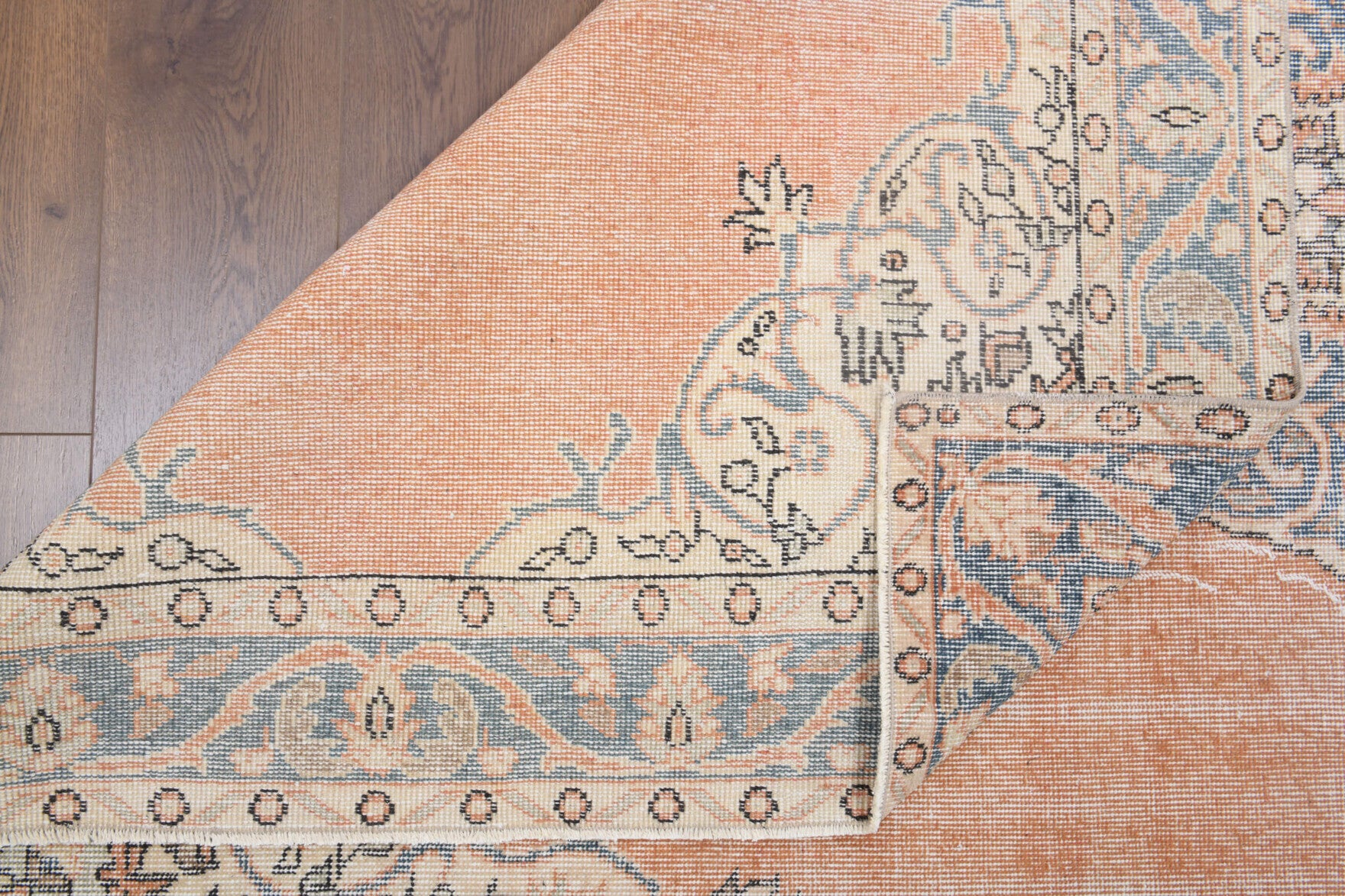 Nurlale rug: 1970s handmade Anatolian rug with oriental medallion motifs and cotton backing