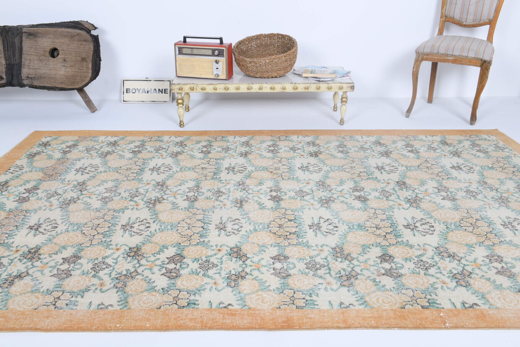 Nino rug: 1970s handmade Anatolian rug with bordered and floral motifs and cotton backing