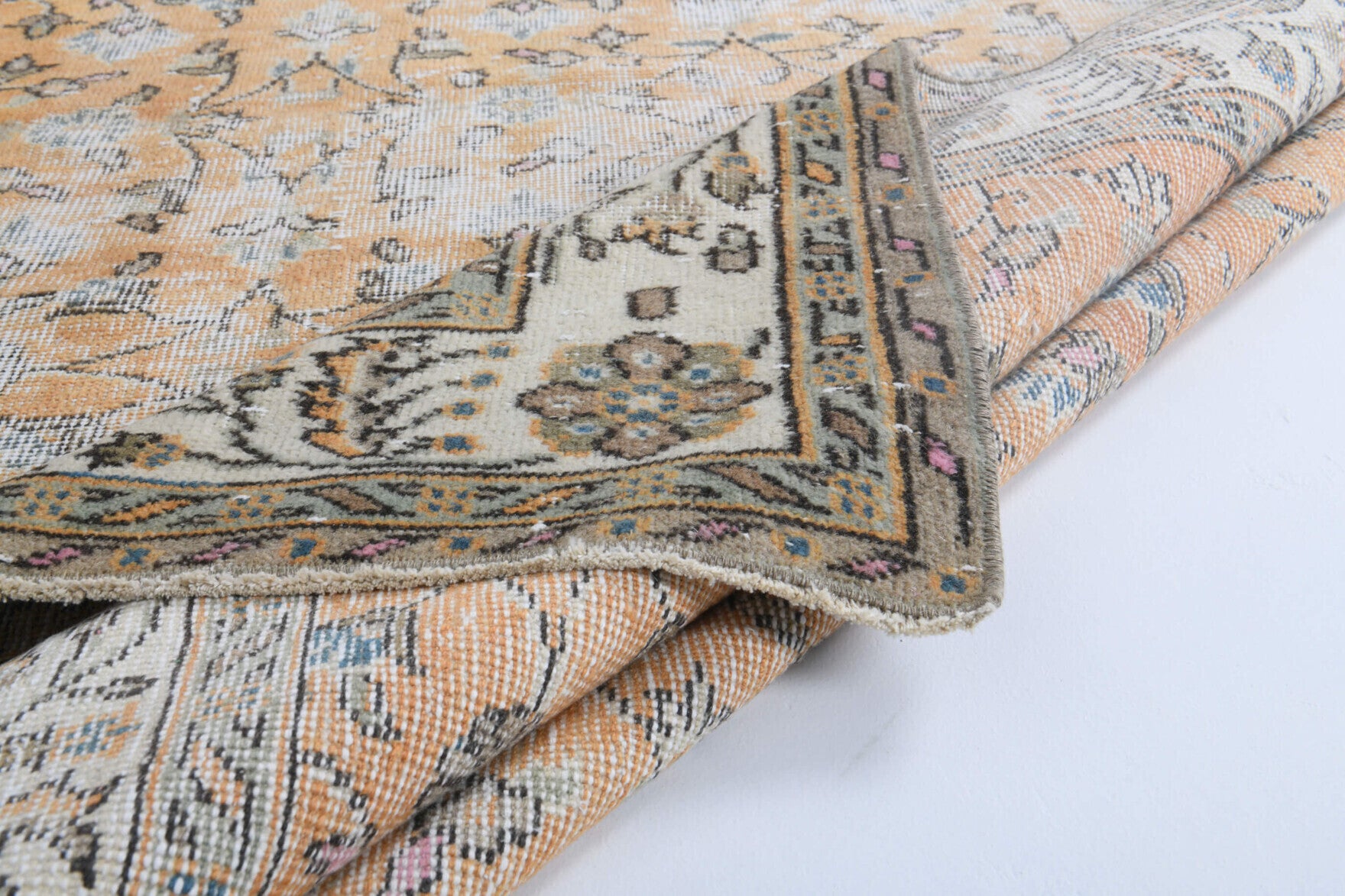 Nimet rug: 1960s handmade Anatolian rug with floral motifs and cotton backing