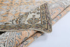 Nimet rug: 1960s handmade Anatolian rug with floral motifs and cotton backing