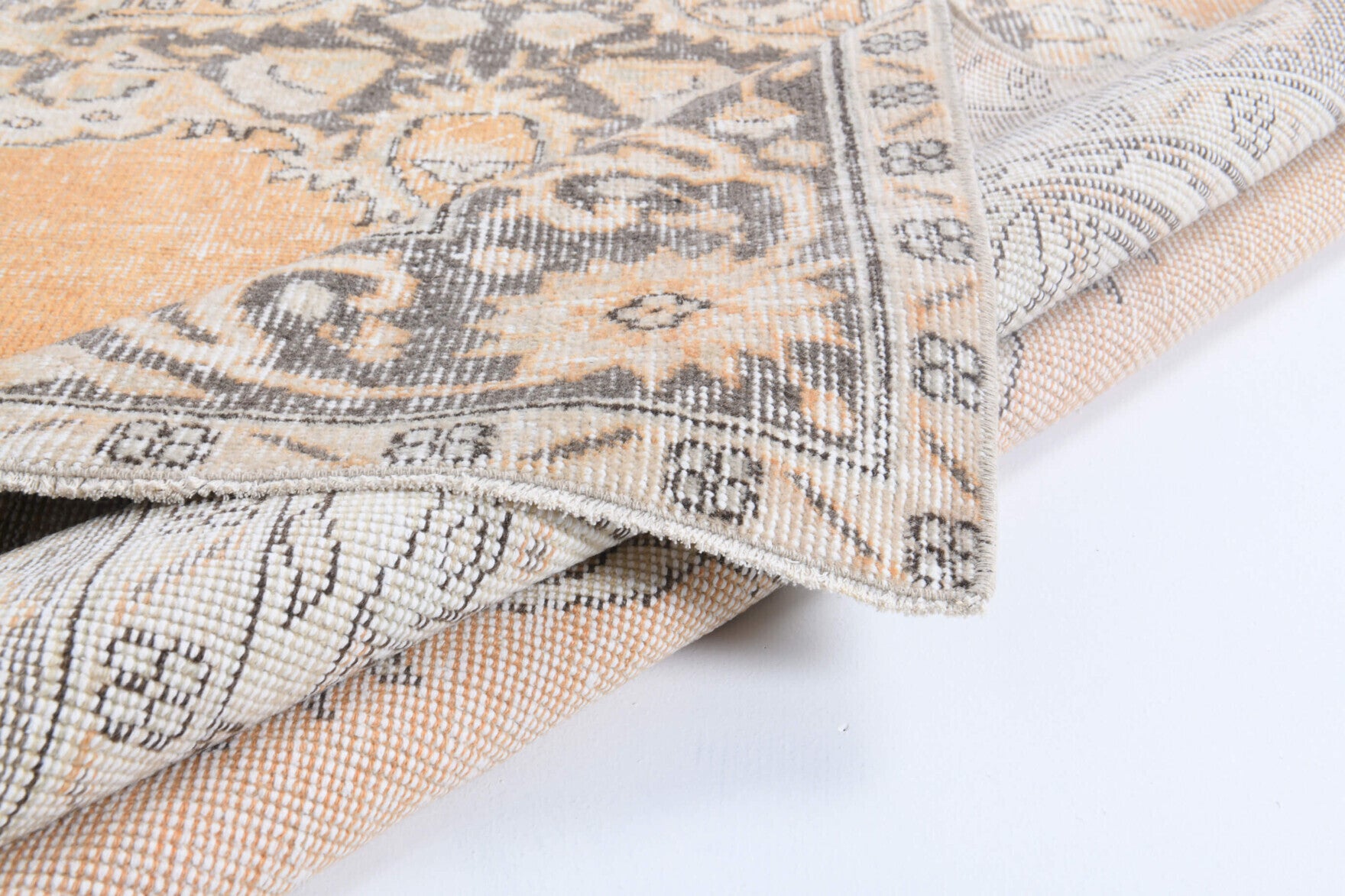 Newroz rug: 1970s handmade Anatolian rug with oriental motifs and cotton backing