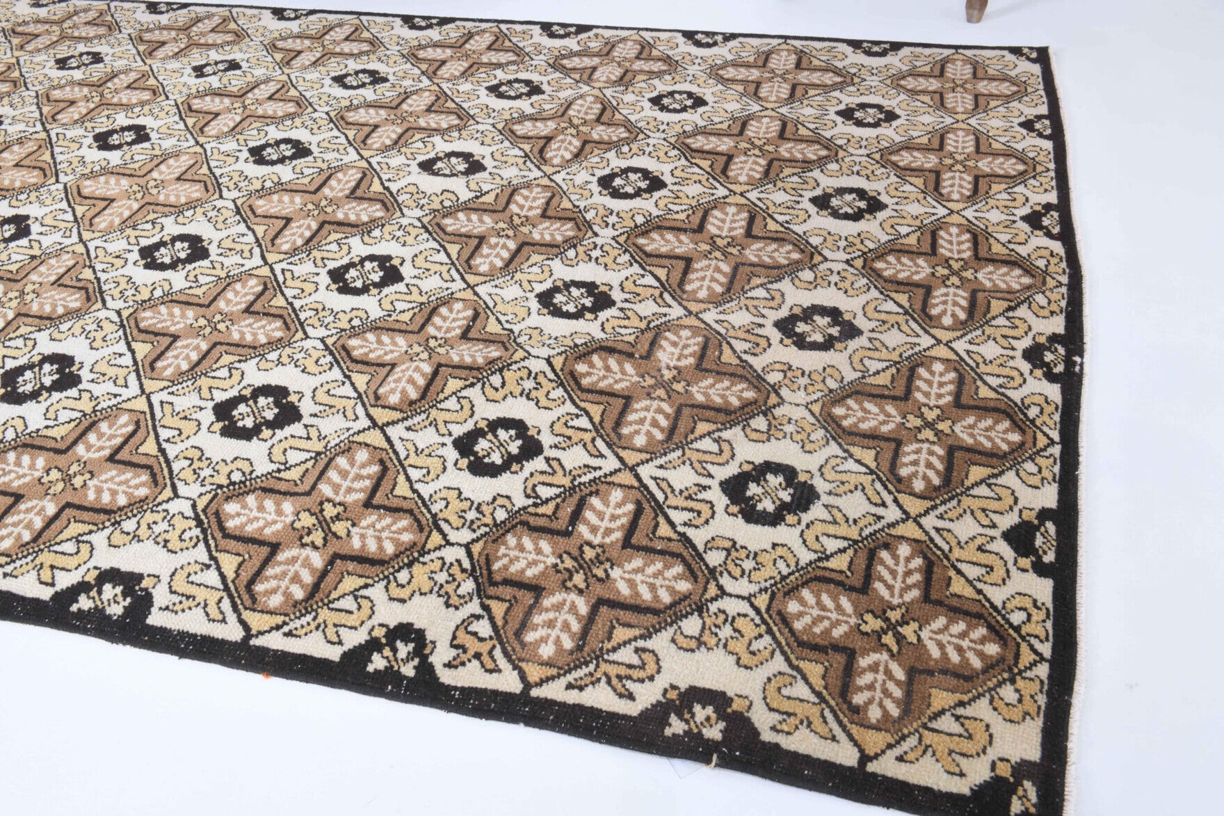 Rhodanthe rug: 1970s handmade Anatolian rug with ikat motifs and cotton backing