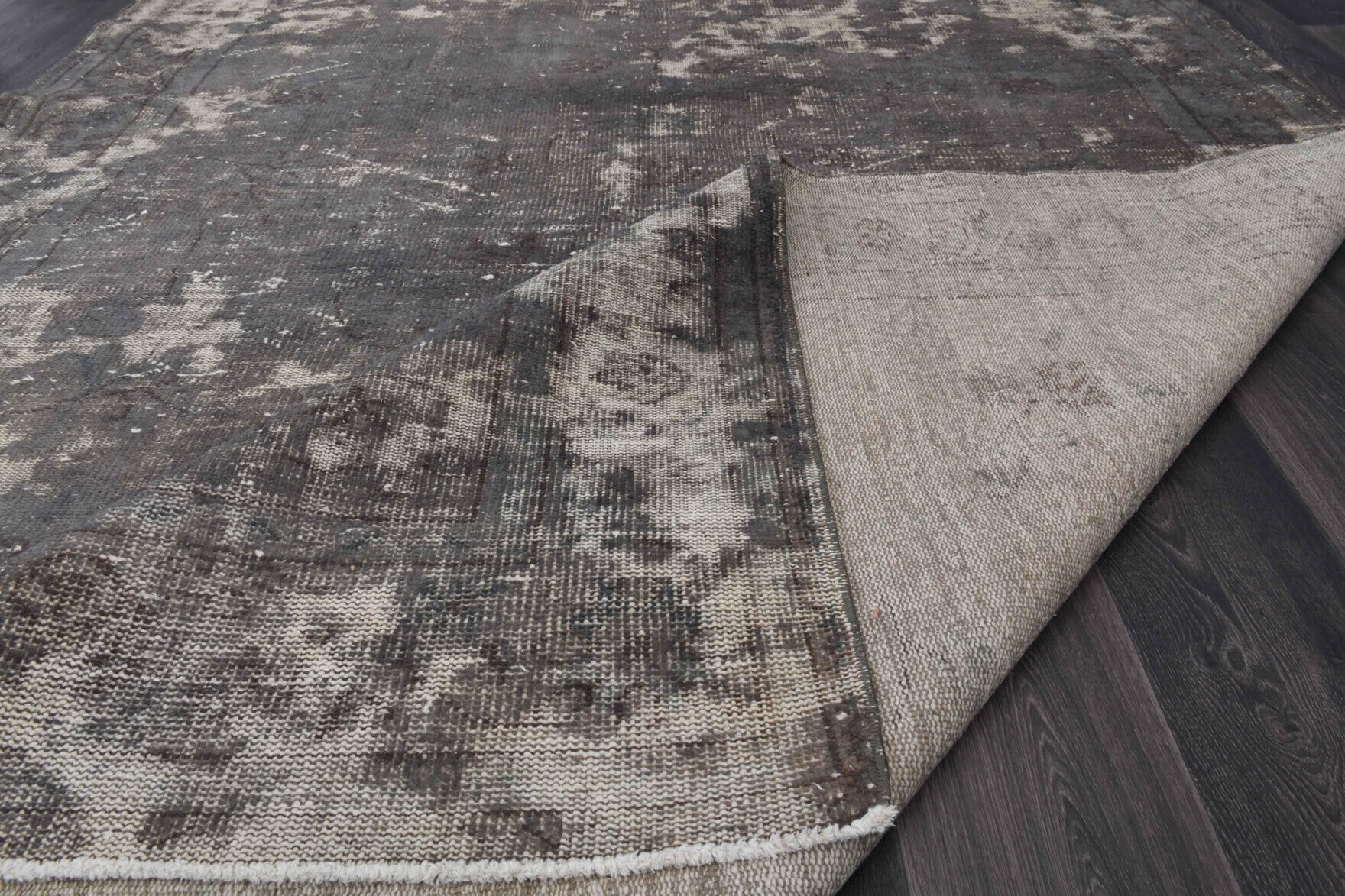 Distressed Black Anatolian Vintage Area Rug in wool – 1970s piece from Anatolia, Turkey | Fame Rugs