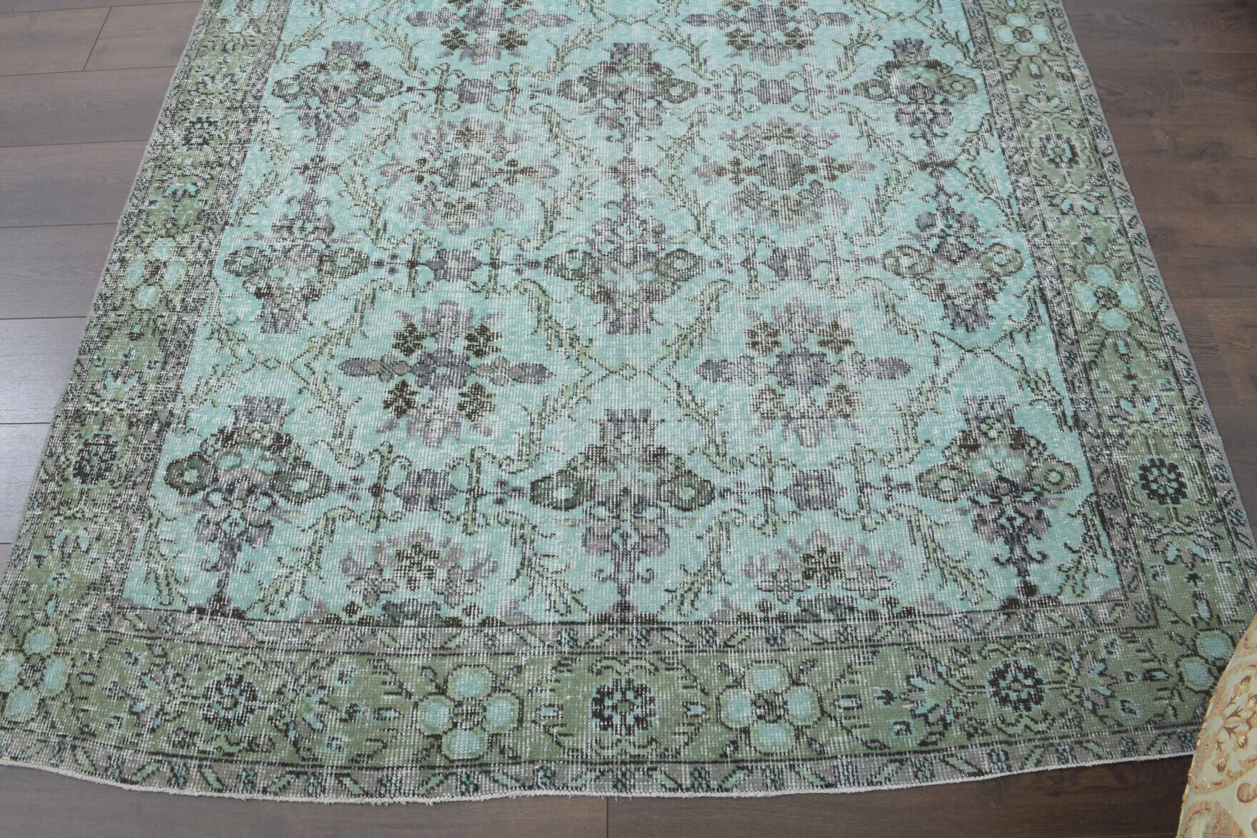 Nilufernur rug: 1970s handmade Anatolian rug with floral motifs and cotton backing