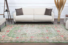 Peitho rug: 1970s handmade Anatolian rug with floral motifs and cotton backing