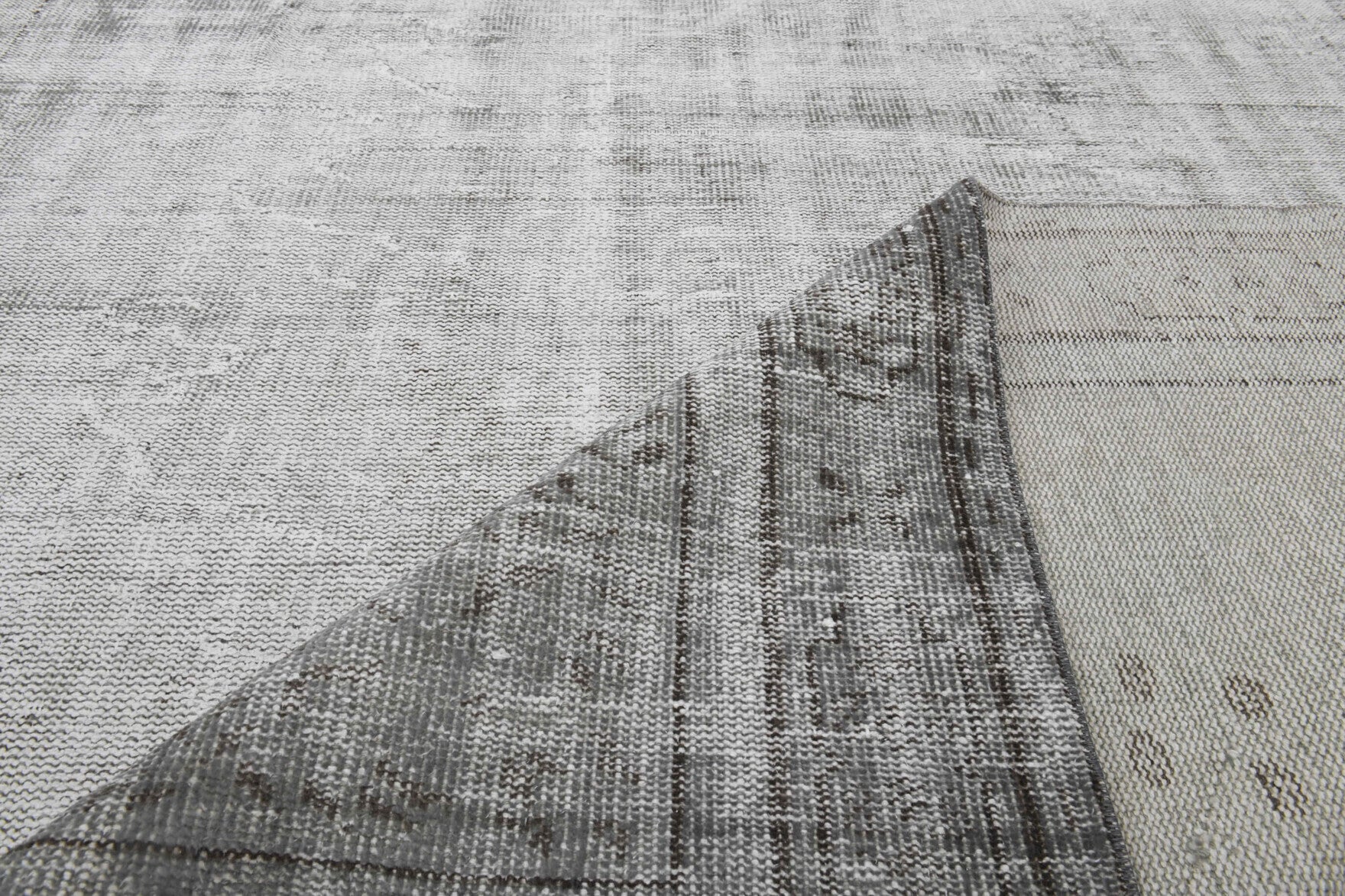 Hand-crafted Anatolian distressed vintage rug Ferahara in wool, 1960s