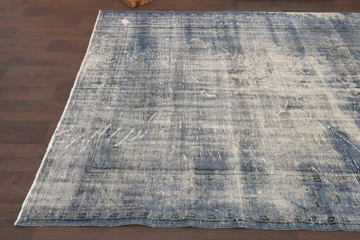 One-of-a-kind 1950s Anatolian distressed vintage area rug in wool, 6'3" x 9'9"