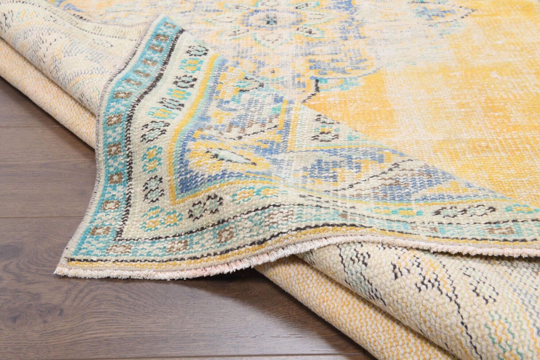 Pamukkale rug: 1970s handmade Anatolian rug with oriental motifs and cotton backing