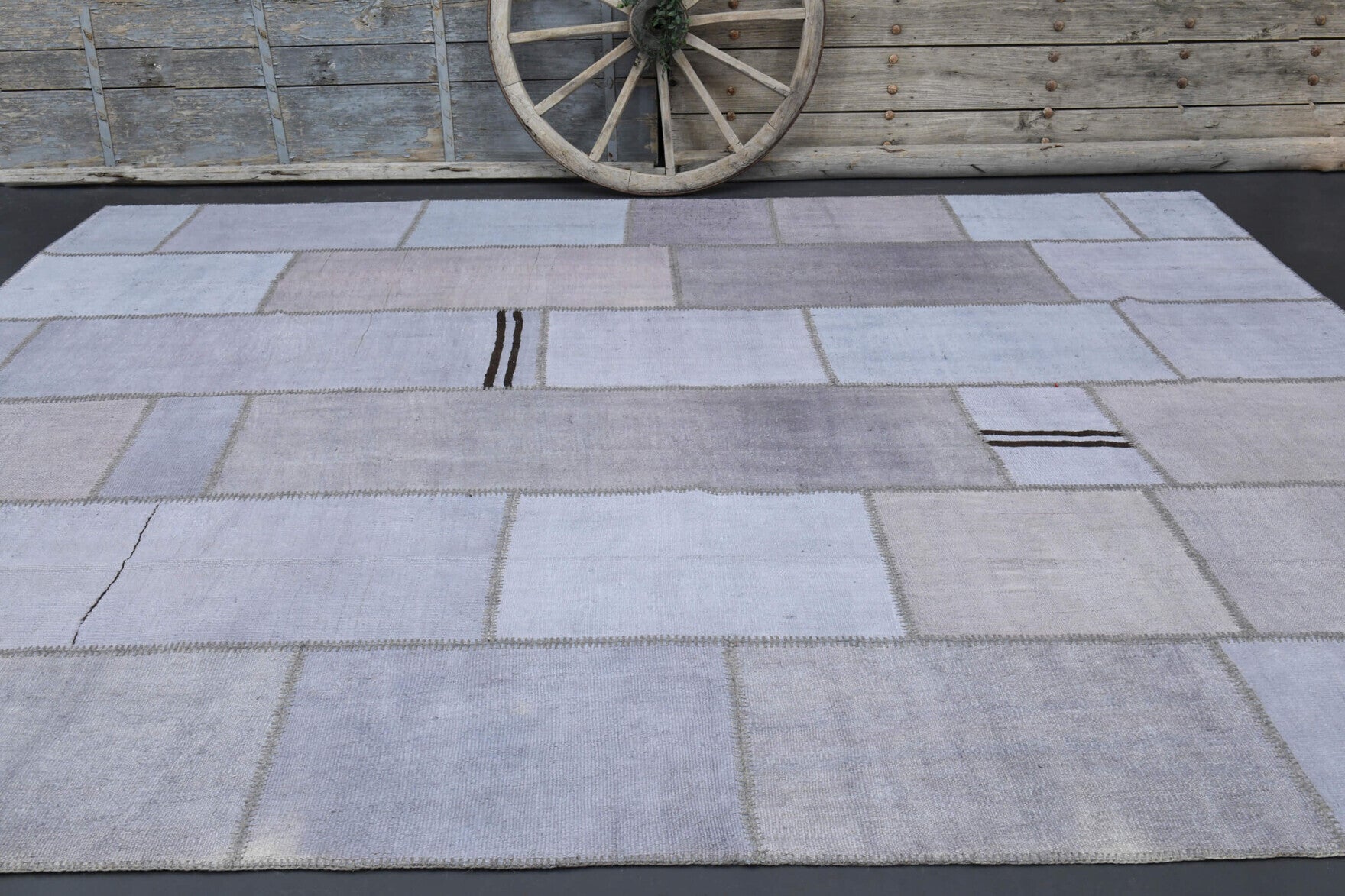 Sunbulisik rug: 1970s handmade Anatolian rug with patchwork motifs and fabric backing