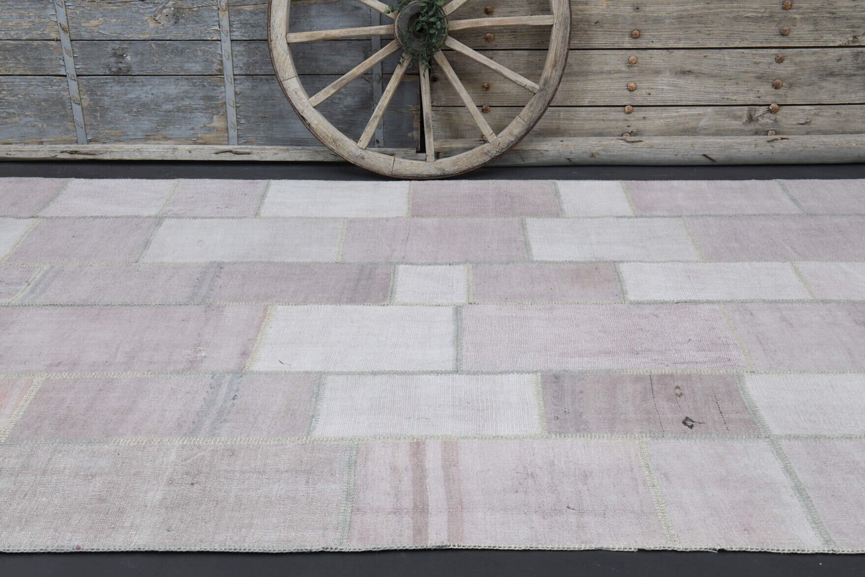 Petromelpe rug: 1970s handmade Anatolian rug with solid motifs and fabric backing