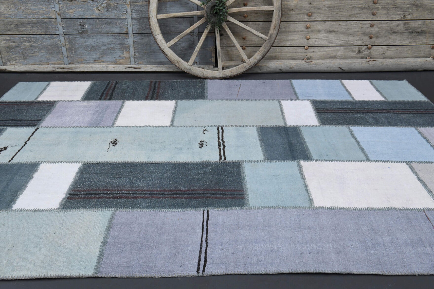 Beharsima rug: 1970s handmade Anatolian rug with solid motifs and fabric backing
