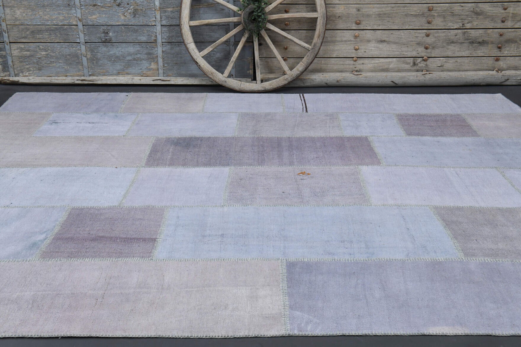 Gumusefruz rug: 1970s handmade Anatolian rug with solid motifs and fabric backing