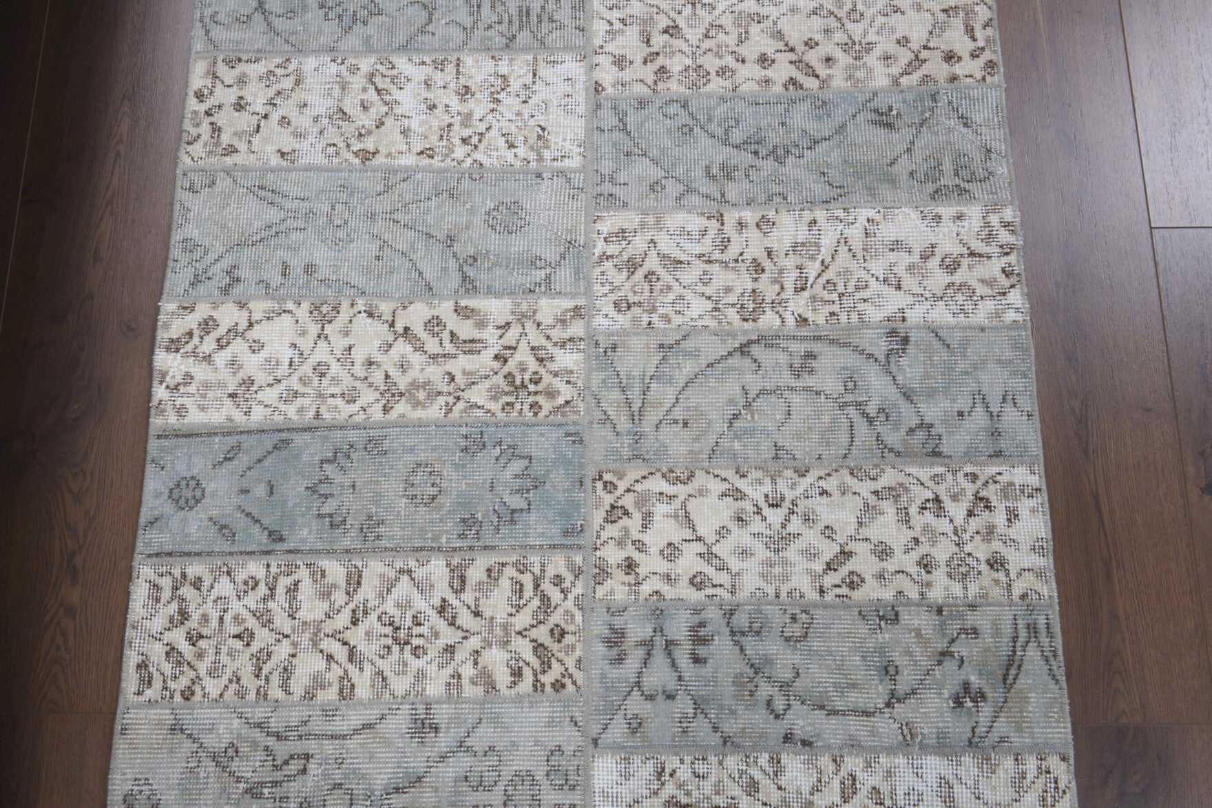 Ceylansel runner: 1970s handmade Anatolian runner with floral motifs and fabric backing