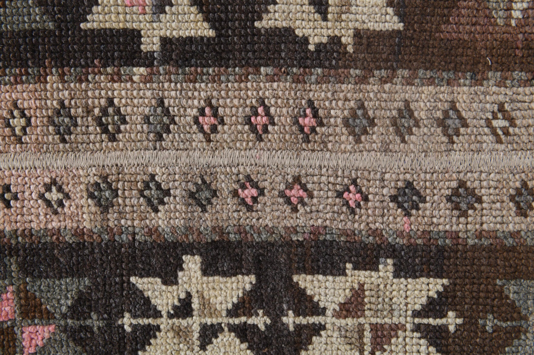Petromeda rug: 1970s handmade Anatolian rug with ikat motifs and fabric backing