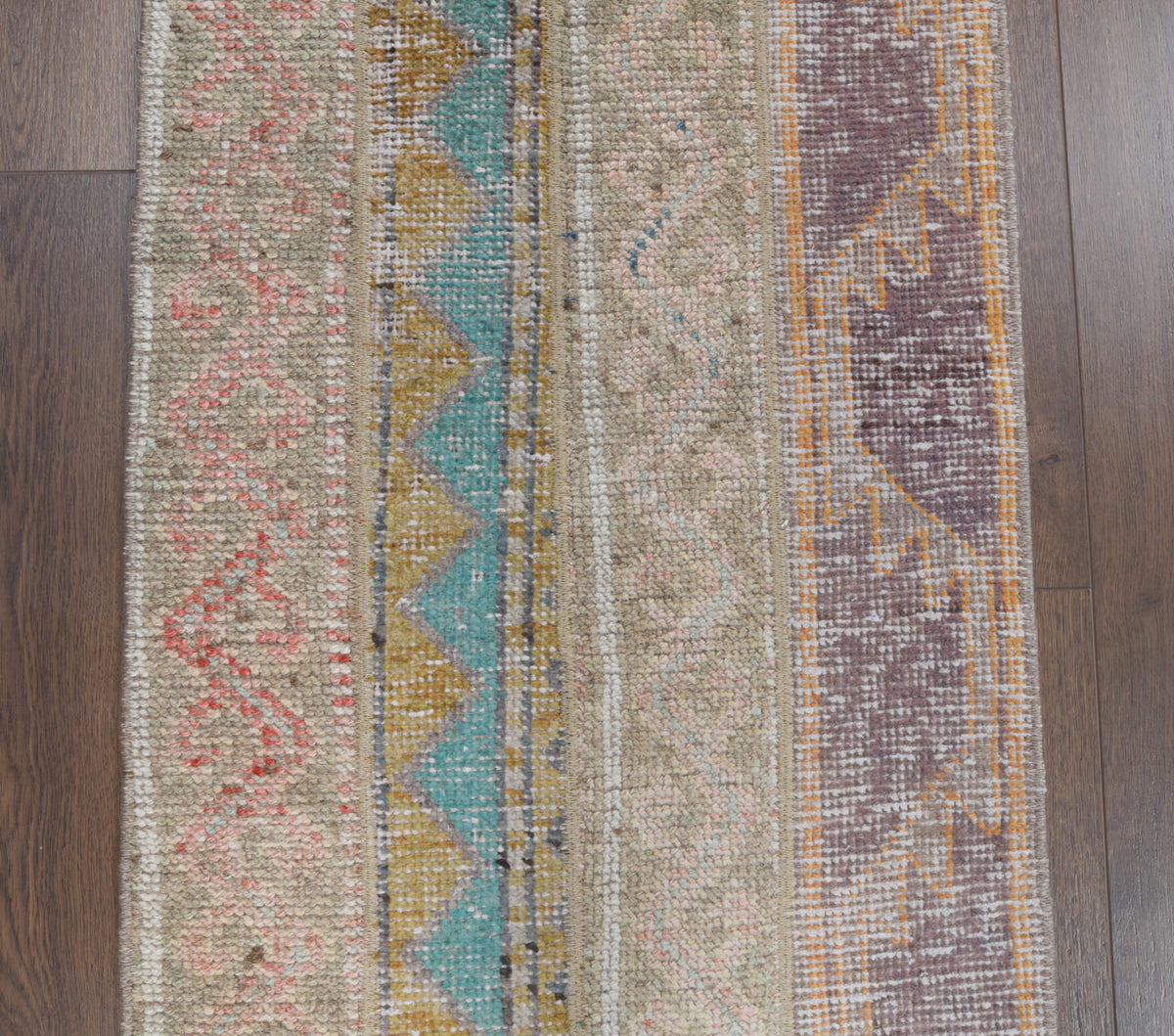 Hosyarsu runner: 1970s handmade Anatolian runner with tribal motifs and fabric backing
