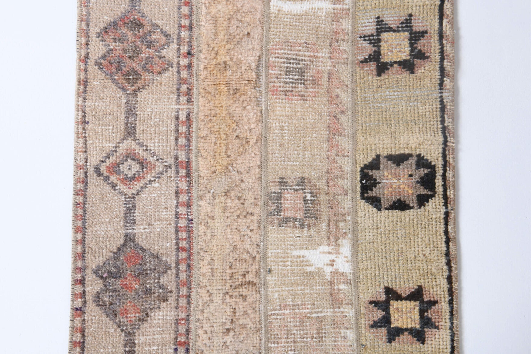 Reyhanyaz runner: 1970s handmade Anatolian runner with tribal motifs and fabric backing