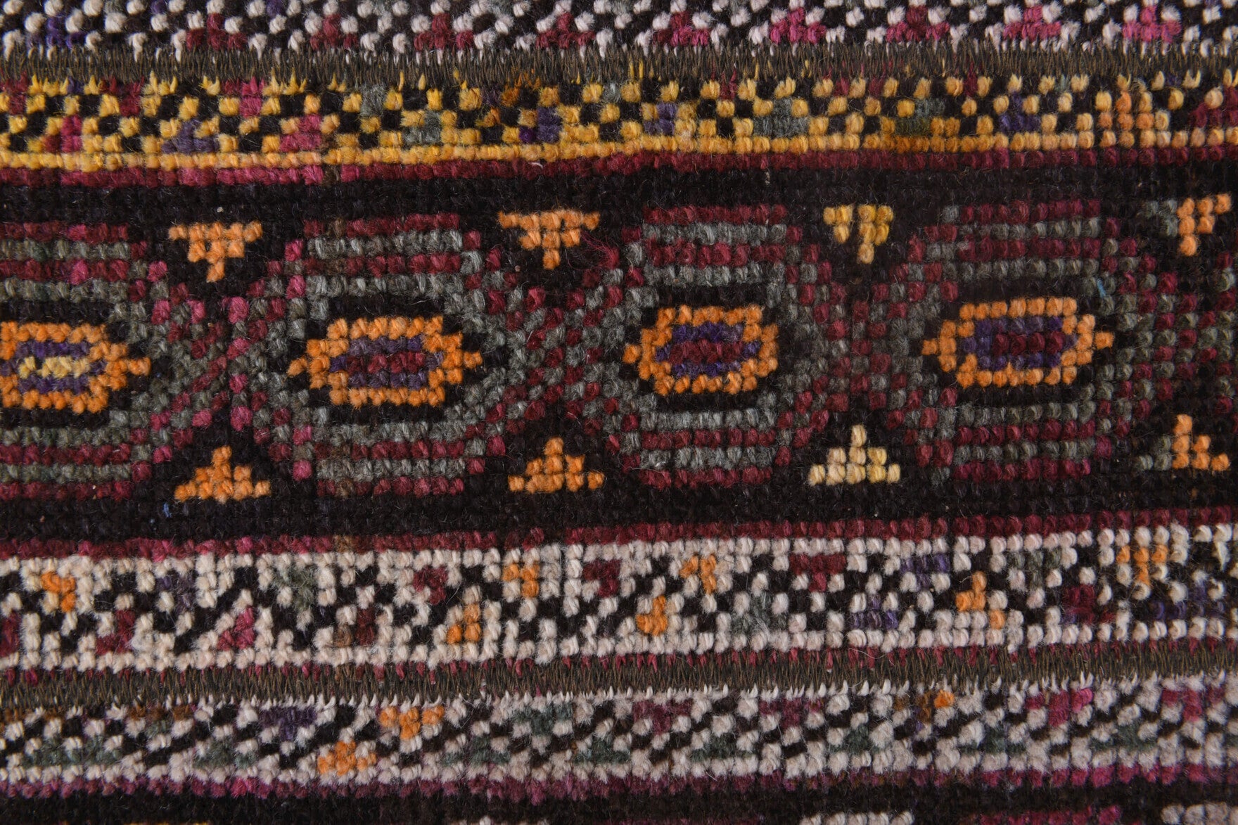 Reyhandeniz rug: 1970s handmade Anatolian rug with ikat motifs and fabric backing