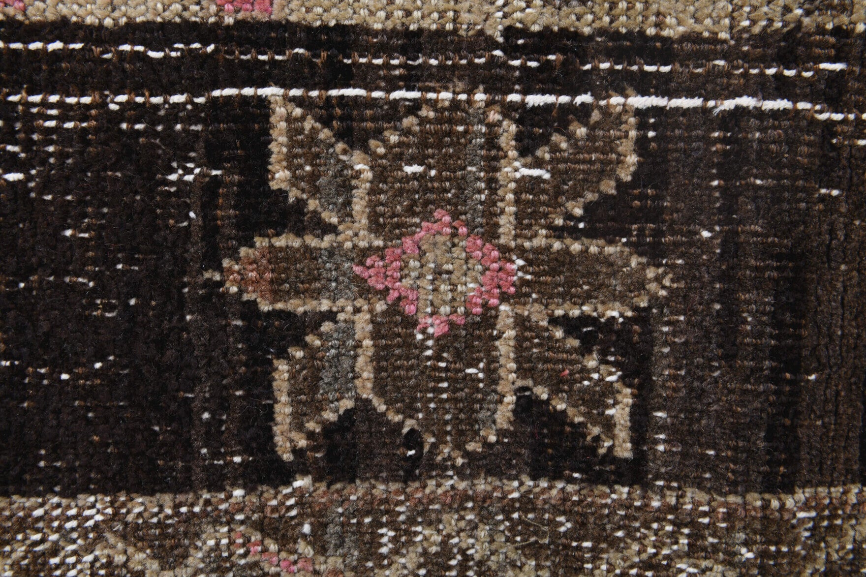 Pleione rug: 1970s handmade Anatolian rug with patchwork motifs and fabric backing