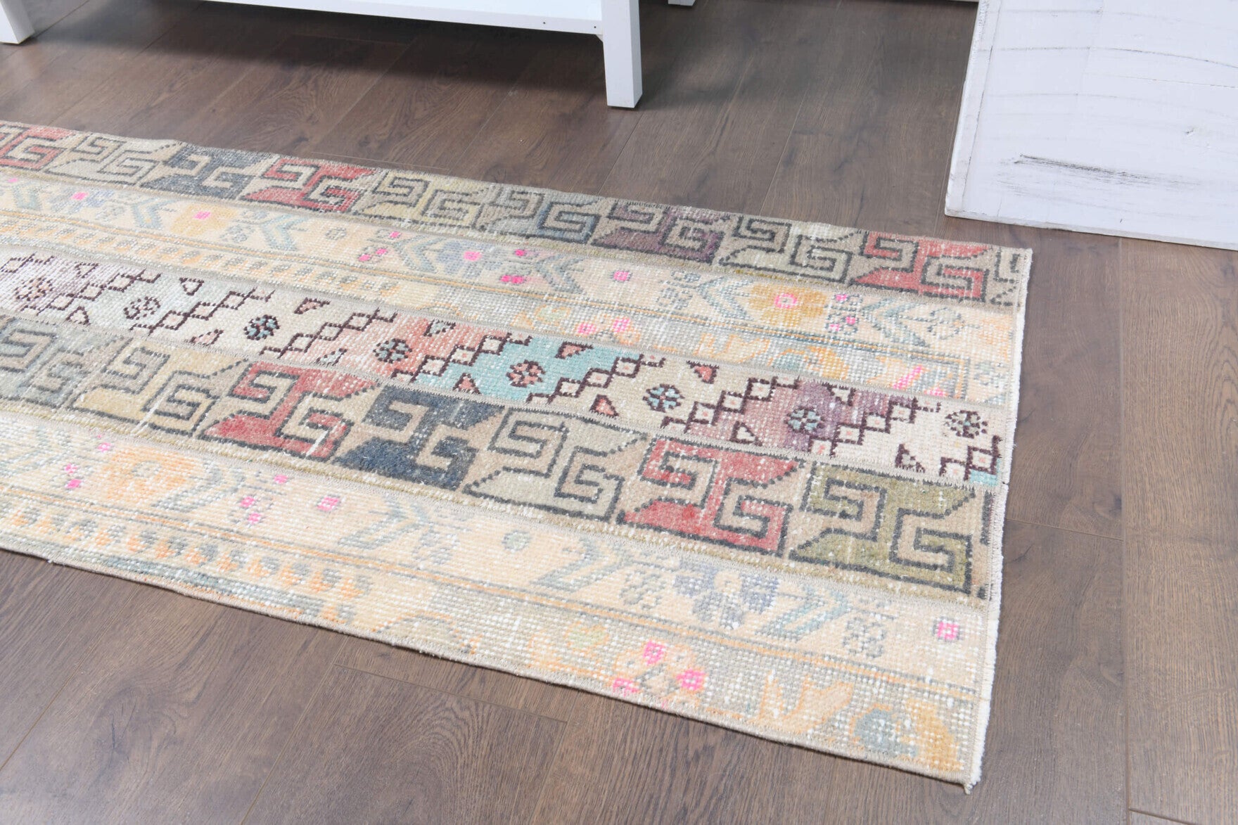 Meltemumut runner: 1970s handmade Anatolian runner with oriental motifs and fabric backing