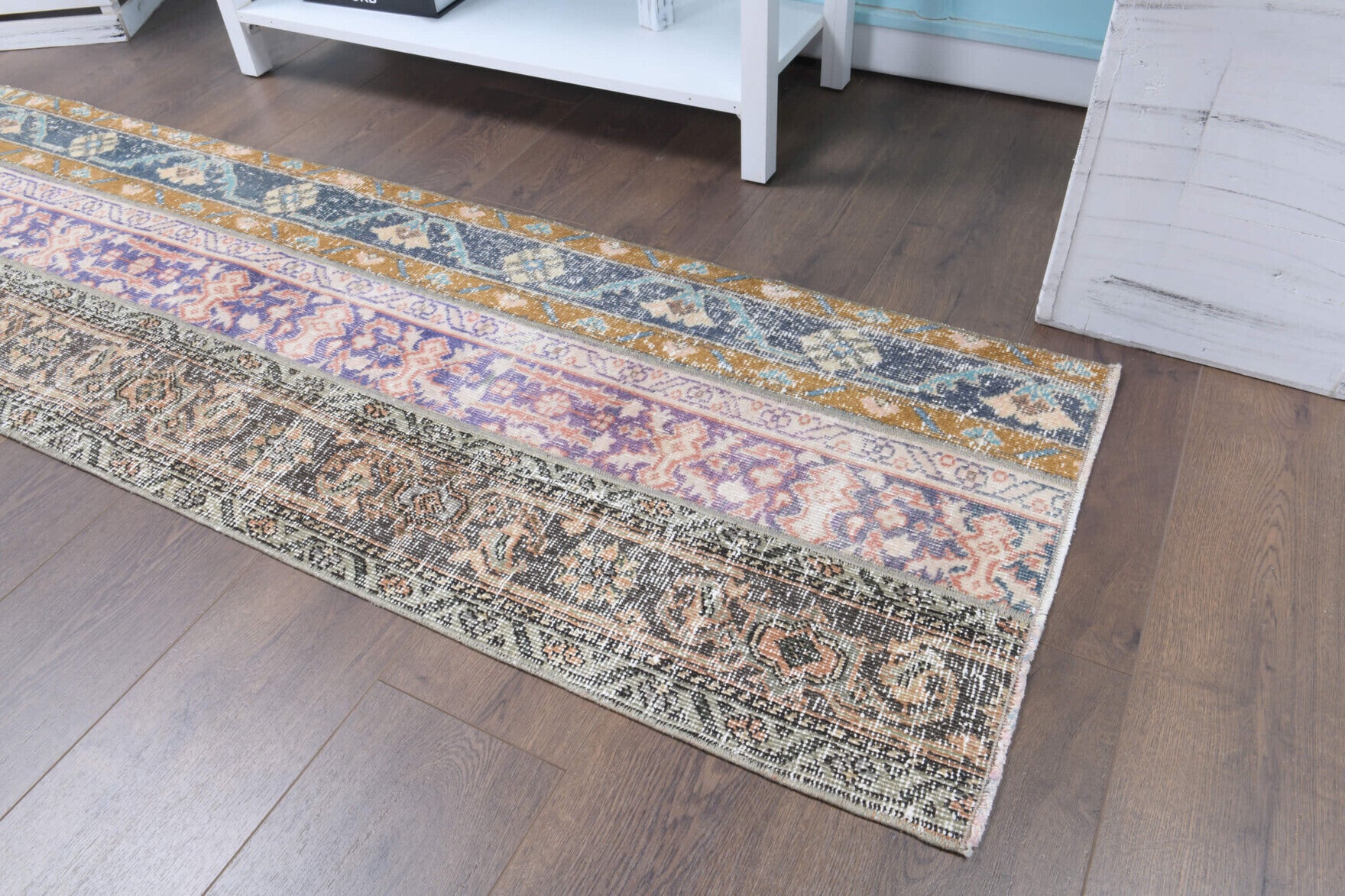 Melitokleia runner: 1970s handmade Anatolian runner with tribal motifs and fabric backing