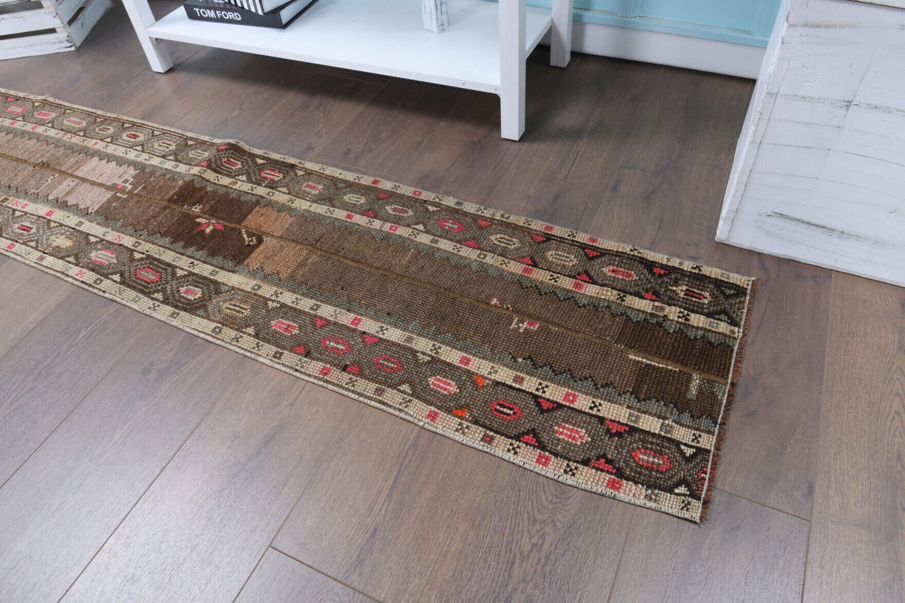Mahparenur runner: 1970s handmade Anatolian runner with tribal motifs and fabric backing