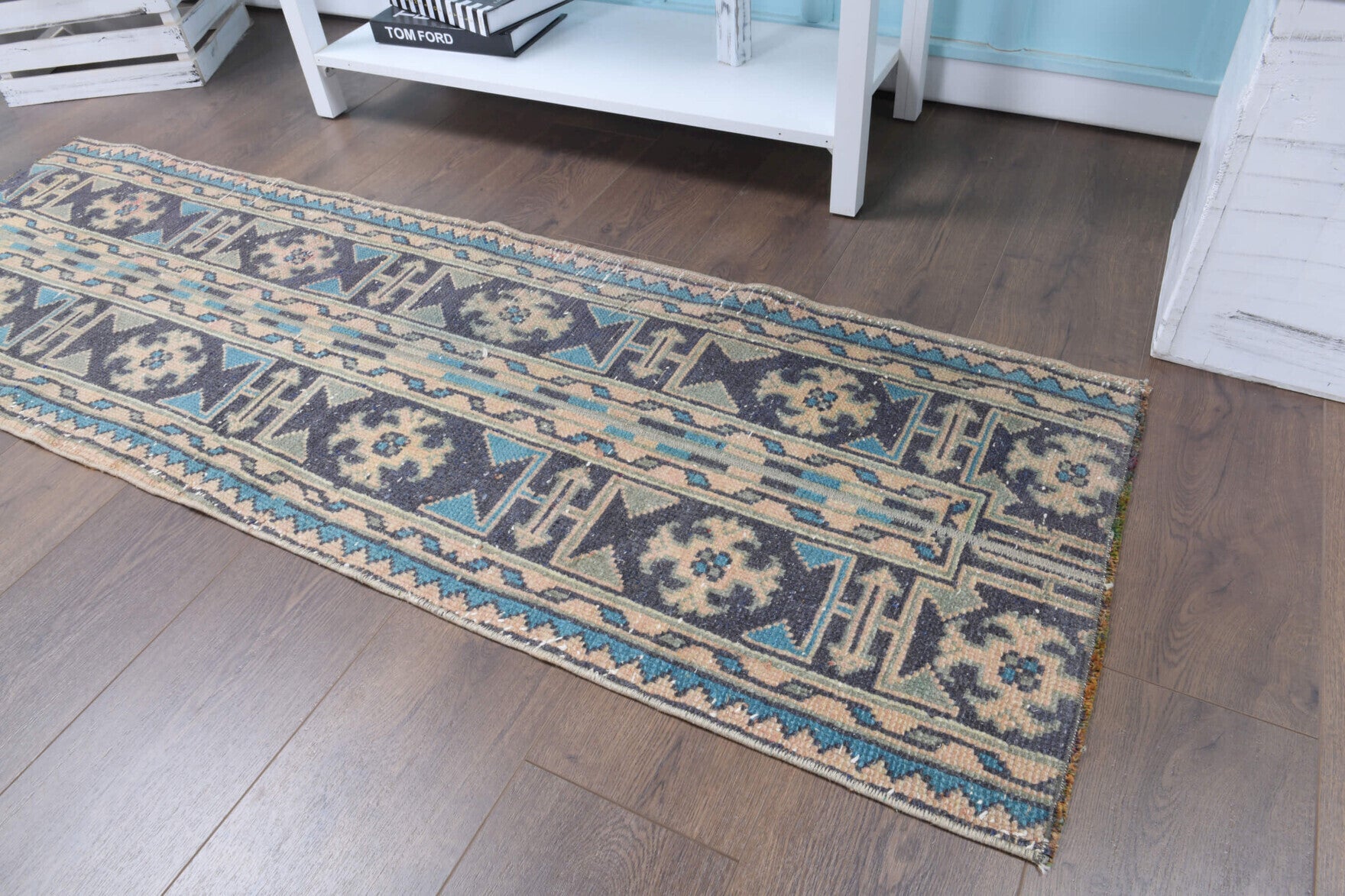 Leucothoe runner: 1970s handmade Anatolian runner with patchwork motifs and fabric backing