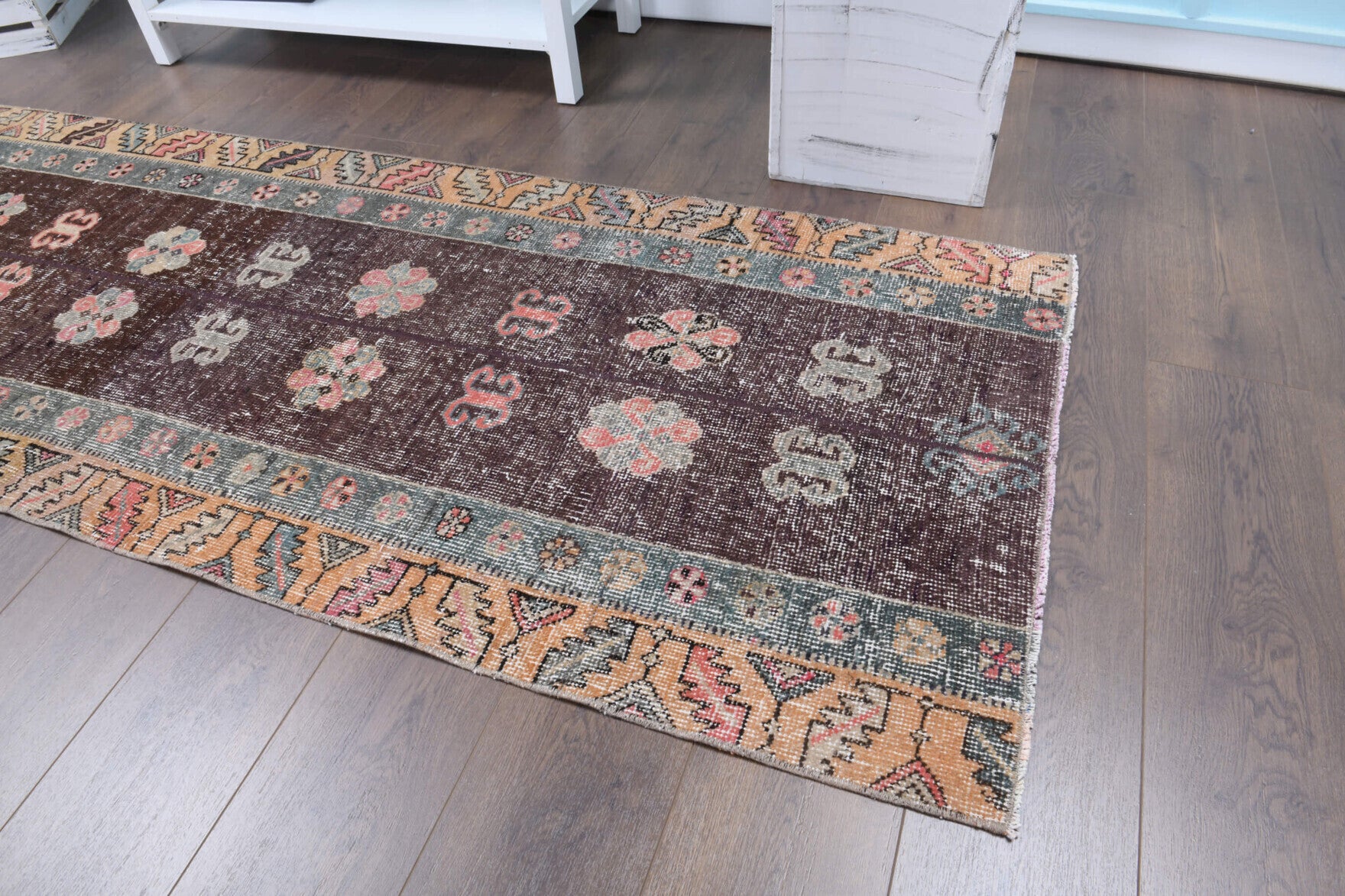 Leucomene runner: 1970s handmade Anatolian runner with patchwork motifs and fabric backing