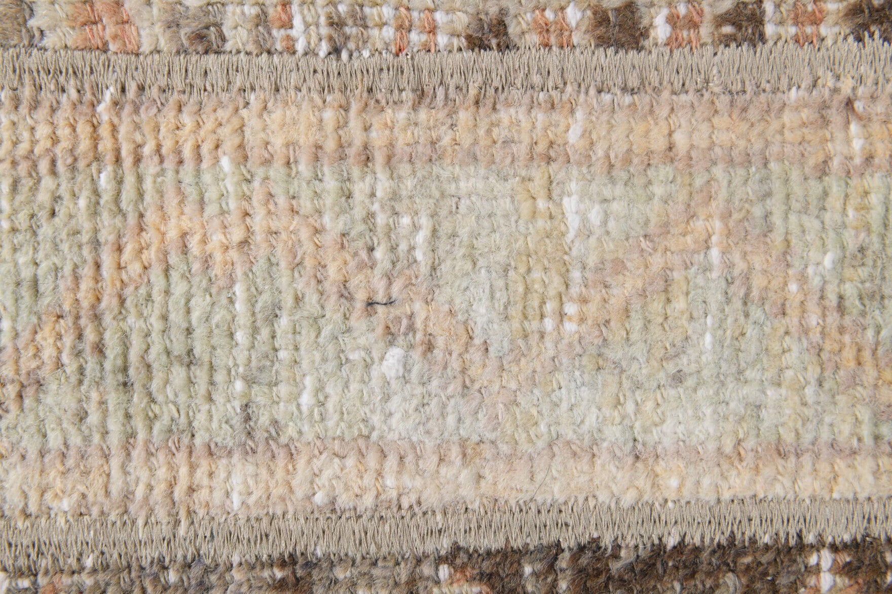 Rhodonassa rug: 1970s handmade Anatolian rug with ikat motifs and fabric backing