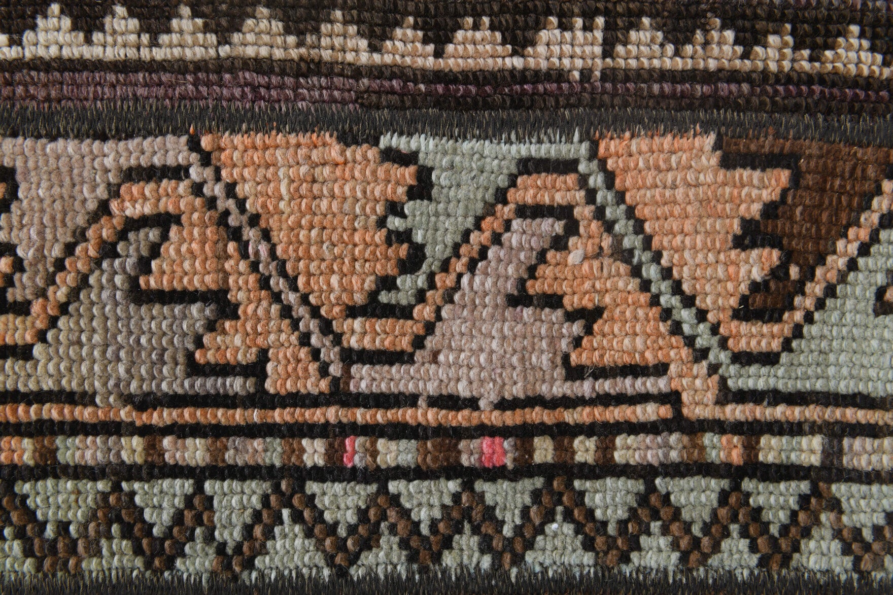 Pyrrolyra rug: 1970s handmade Anatolian rug with tribal motifs and fabric backing