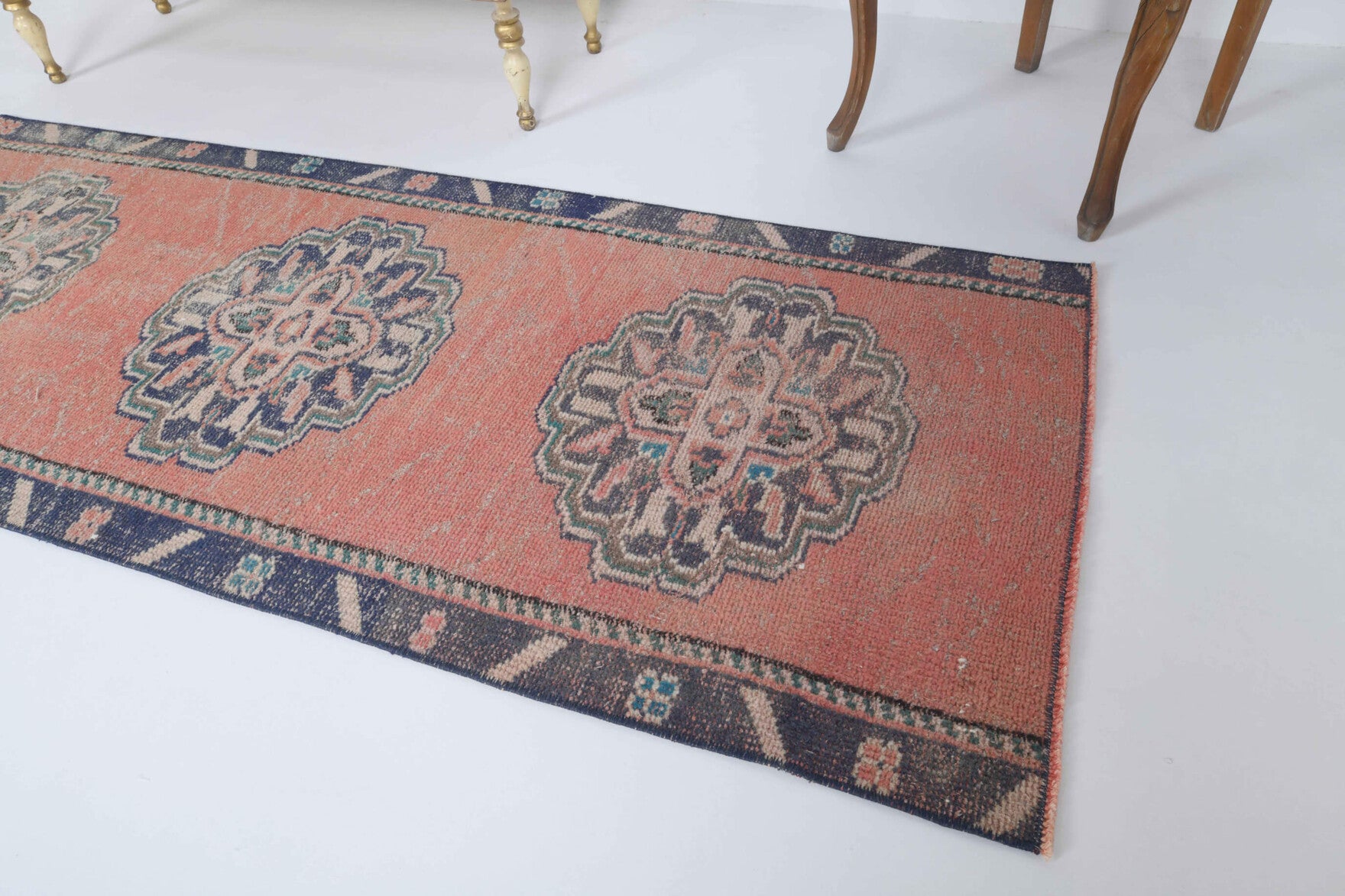 Eleuthesthene runner: 1970s handmade Anatolian runner with tribal motifs and cotton backing