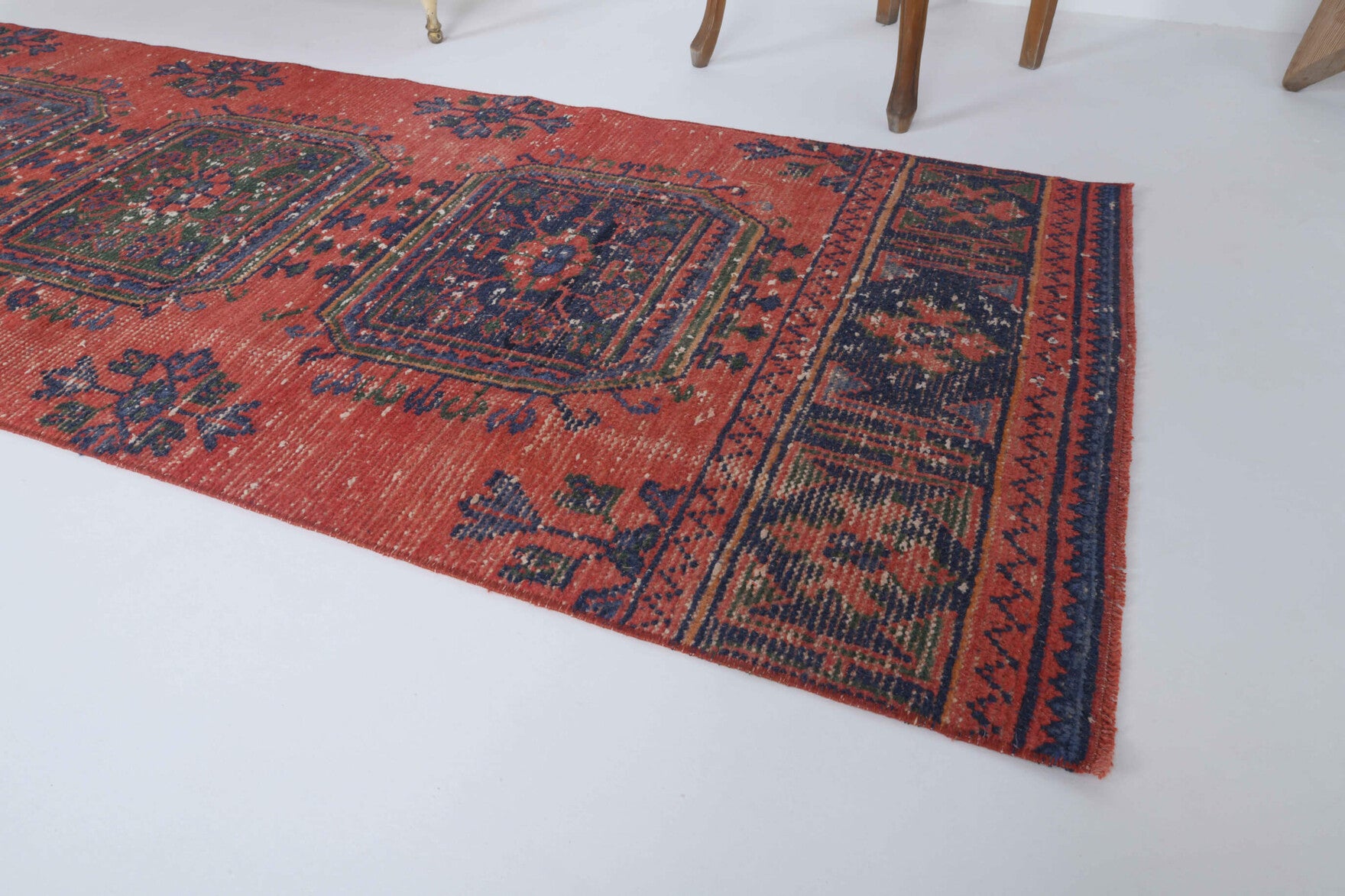 Ebrubike runner: 1970s handmade Anatolian runner with floral motifs and cotton backing