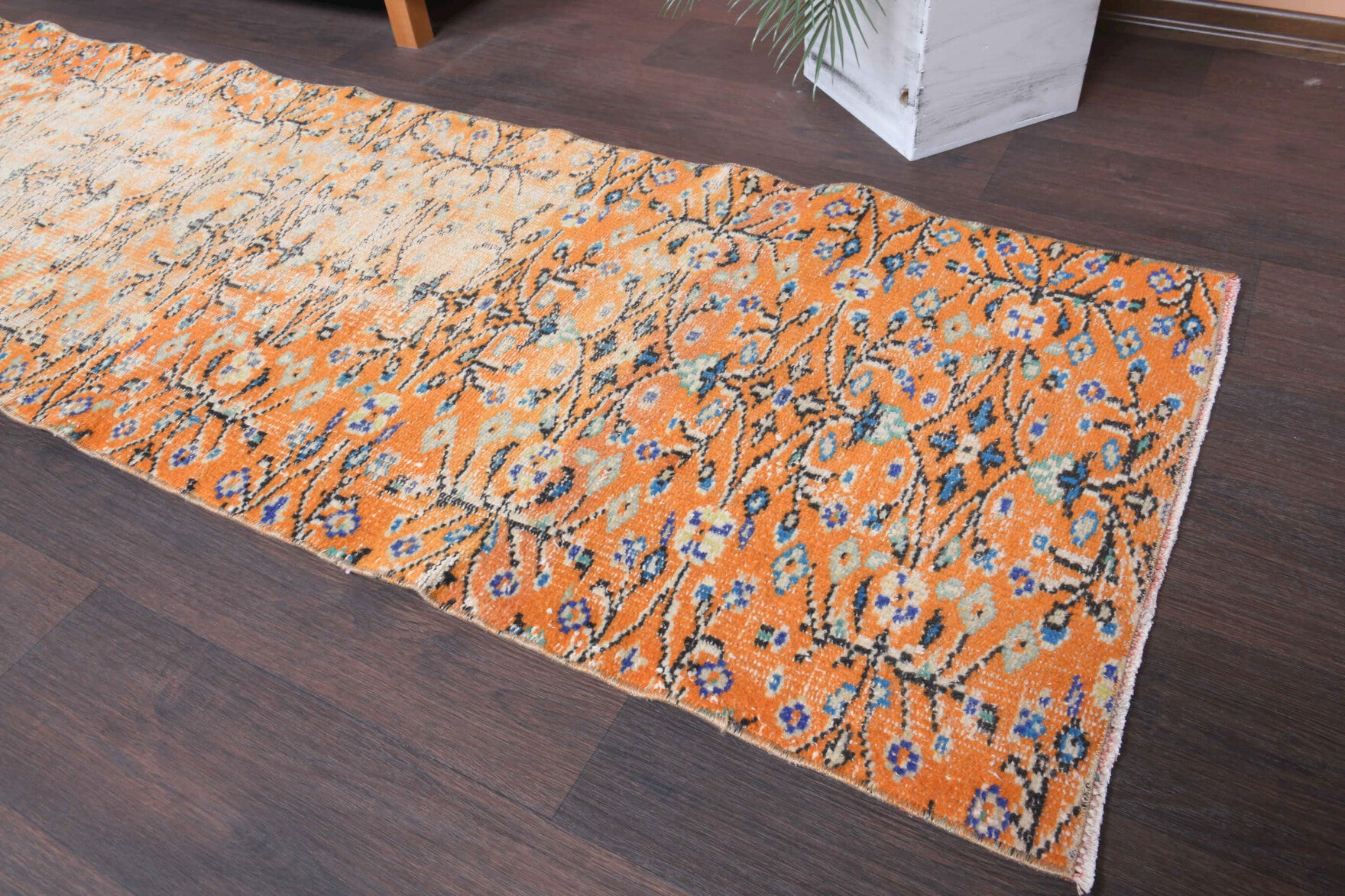 Defnenihal runner: 1970s handmade Anatolian runner with floral motifs and cotton backing