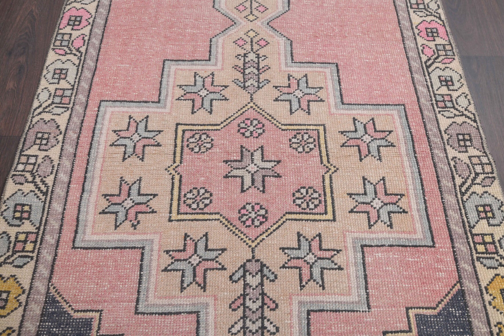 Yagmurter runner: 1970s handmade Anatolian runner with oriental motifs and cotton backing